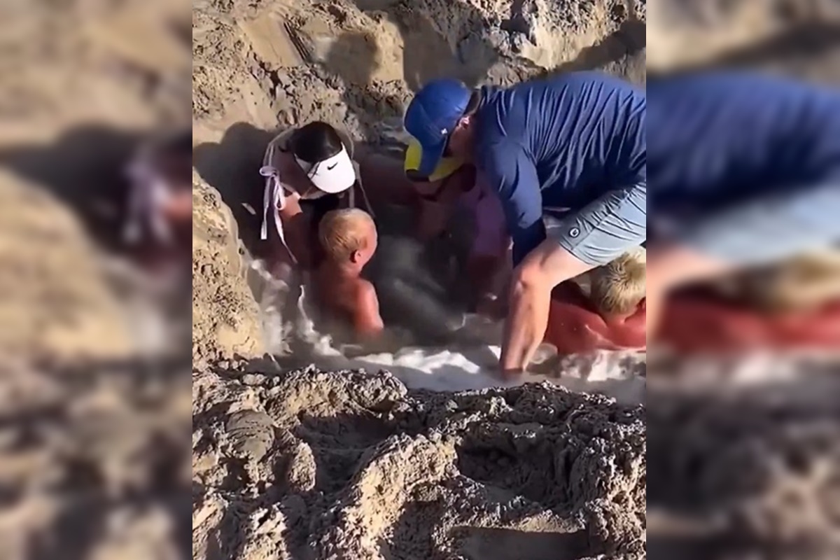 Crianças ficam presas em buraco na areia da praia nos EUA. Vídeo